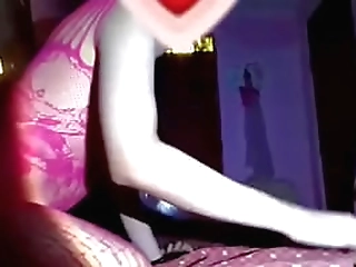 feminine ladyboy in black fishnets is tugging her ladystick