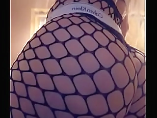 ladyboy in fishnet masturbates solo and cums a lot
