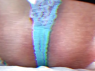 teen shemale in bikini applies lotion to her growing shecock